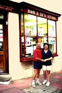 Bob and Di outside their shop